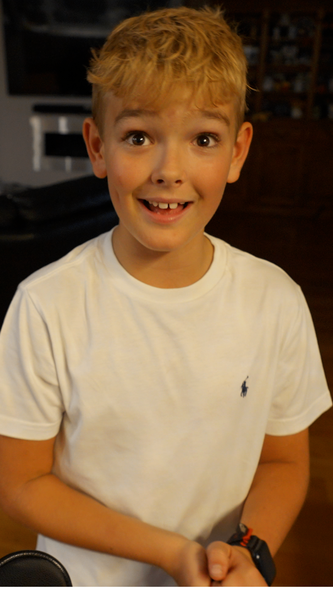 Sam, the 10-year-old creator of Rage Bait Arena, laughing